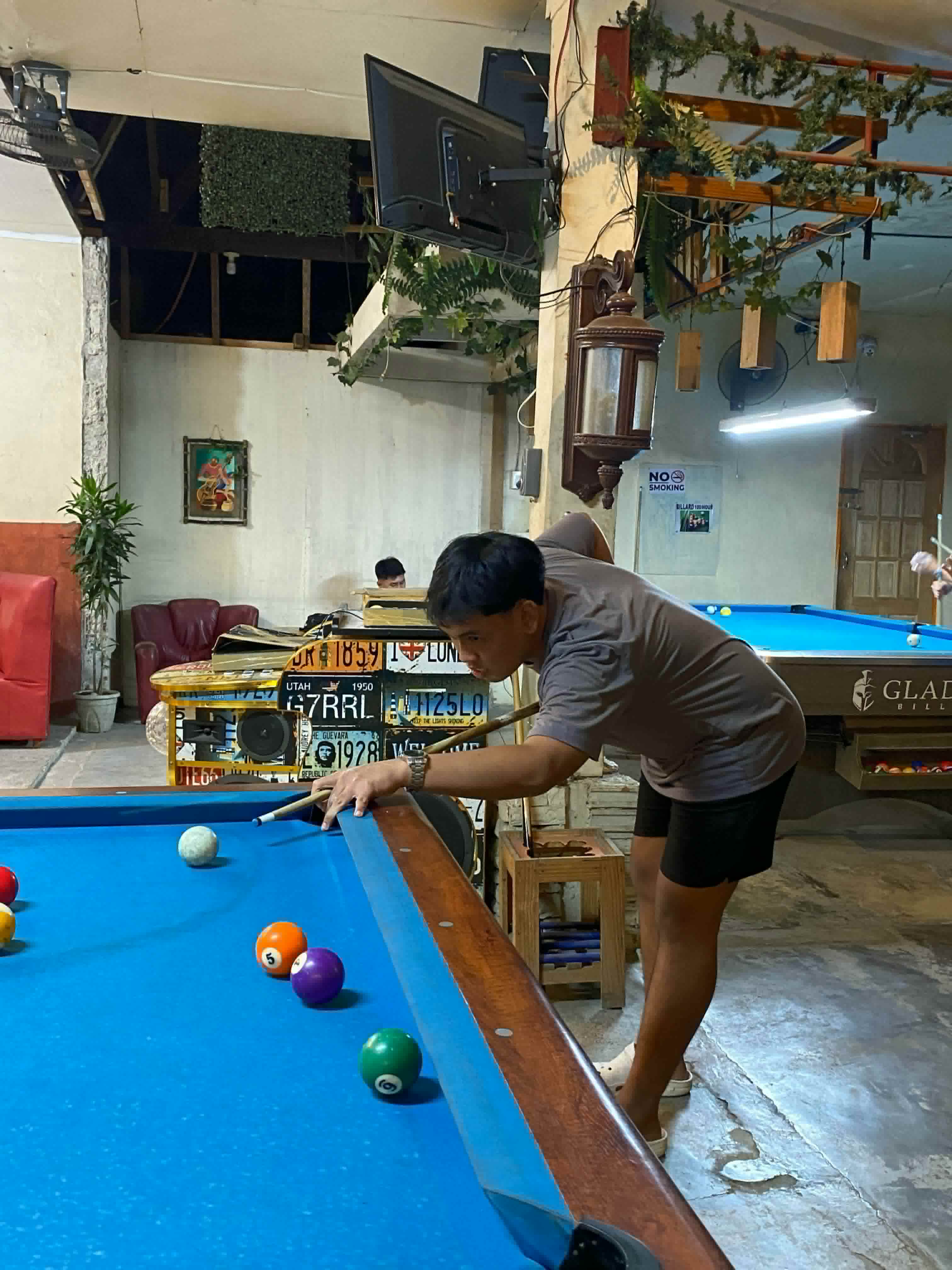 Lining up a shot at the pool table