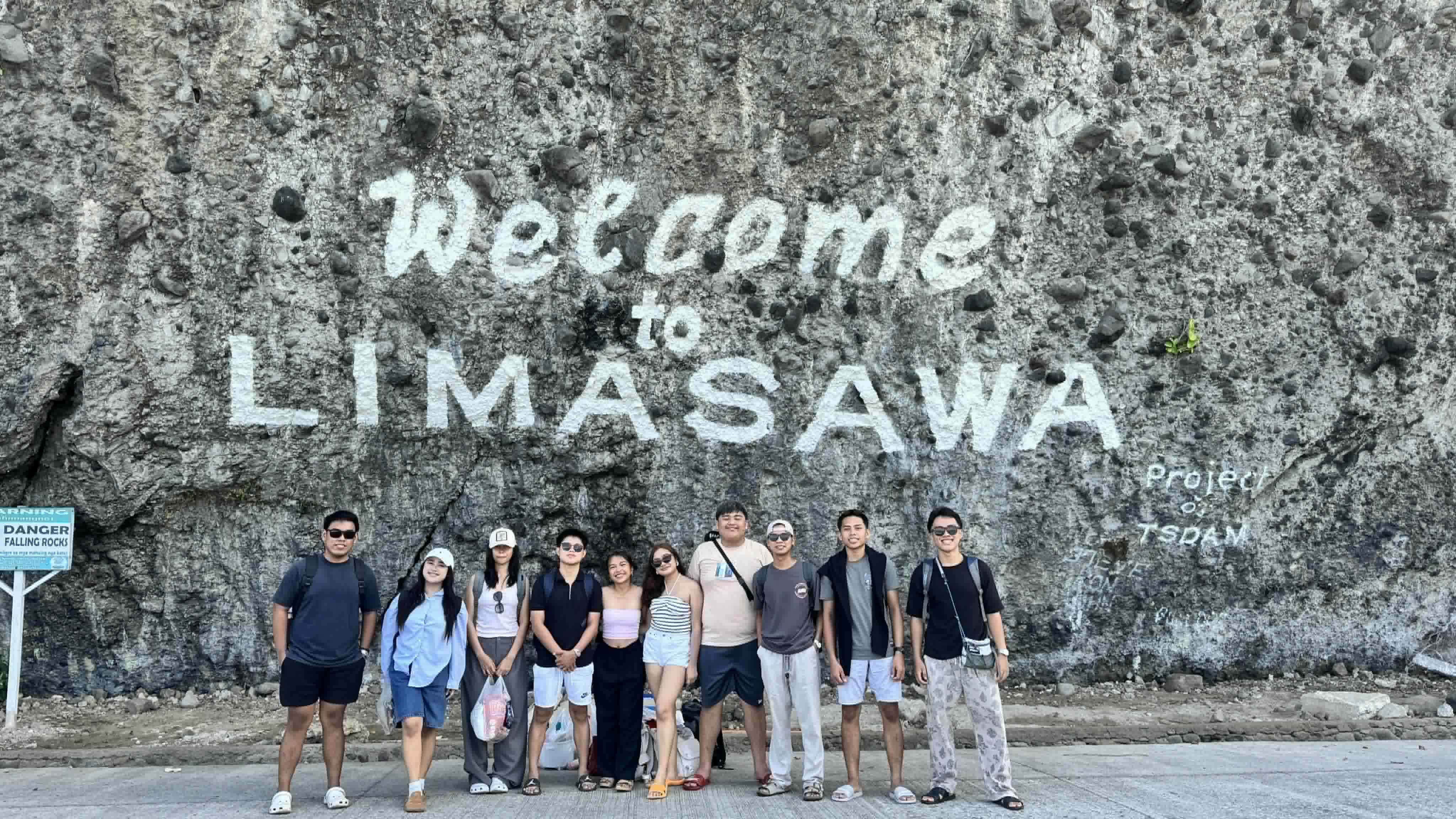 Group photo with high school friends at the Limasawa welcome sign